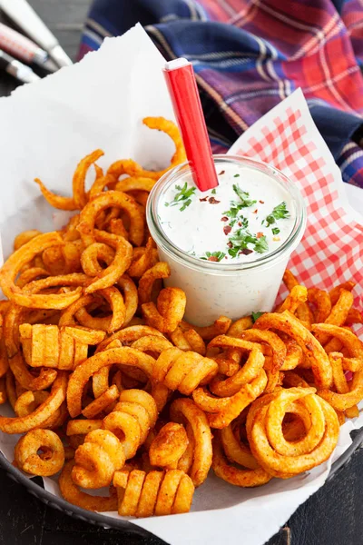 Basket full of curly fries — Stock Photo, Image