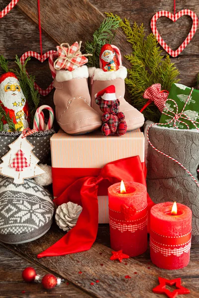 Boots with little presents and candy — Stock Photo, Image