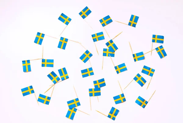 Swedish flags on the white background. Swedish flag concept. Scandinavian pattern.