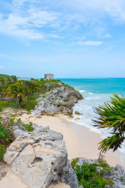 Ruins of ancient Tulum. Architecture of ancient maya. View with sea. Blue sky and lush greenery of nature. travel photo. Wallpaper or background. Yucatan. Mexico.