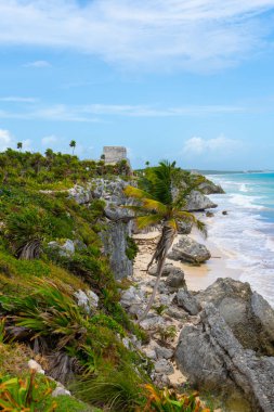 Ruins of ancient Tulum. Architecture of ancient maya. View with sea. Blue sky and lush greenery of nature. travel photo. Wallpaper or background. Yucatan. Mexico.