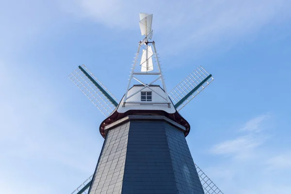 Wooden windmill against the blue sky — Stock Photo, Image