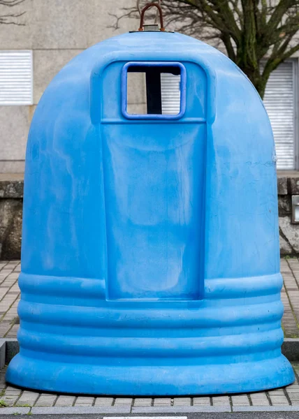 blue street garbage container close-up