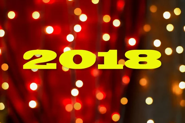 Siffror 2018 på bakgrunden av festliga bokeh — Stockfoto