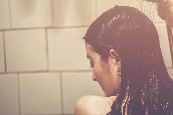 Beautiful girl standing in the shower. Portrait of a happy half- — Stock Photo, Image