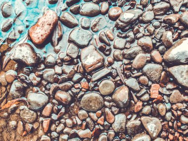 Çakıl taşı plajı arka planı, taş zemin. Soyut doğa çakıl taşları ba