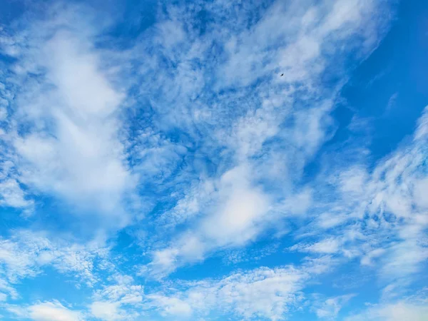 The vast blue sky, clouds sky. Blue sky background with tiny clouds. Sky panorama. Beautiful sky. Sky cloud wallpaper.