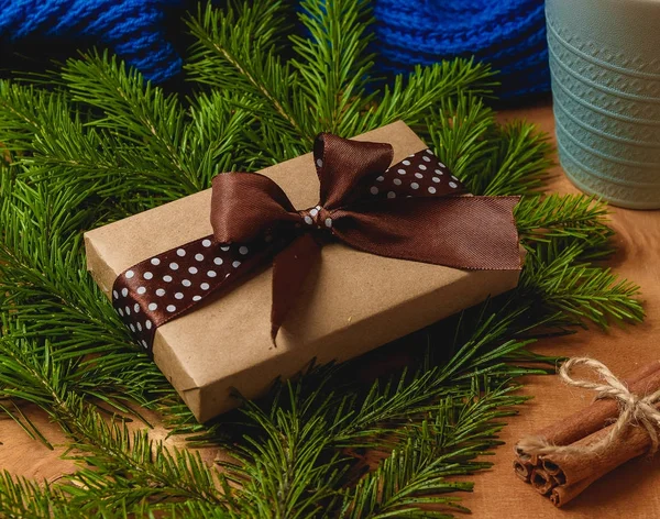 Christmas gift or present box wrapped in kraft paper on christmas decoration