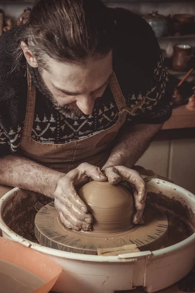 Adult male potter master mashing the clay — Stock Photo, Image