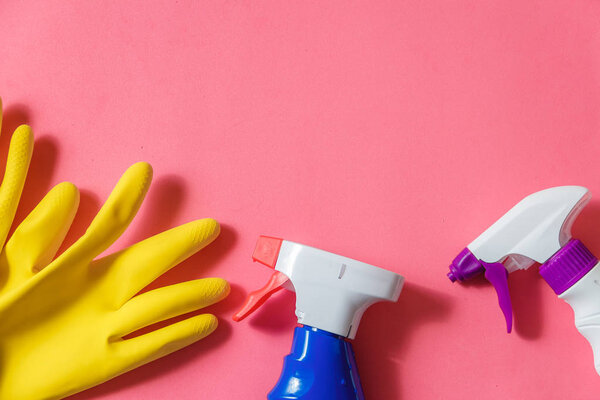 Cleaning Products. Home Cleaning Concept. Pink Background. Typography and Logo. Copy space. Flat Lay. Top View.