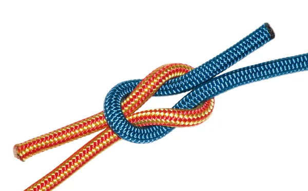 Reef knot, yellow and blue ropes. — Stock Photo, Image