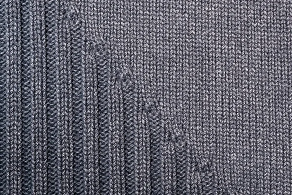 Fragment of knitted clothes in gray. Close-up. Top view — 스톡 사진