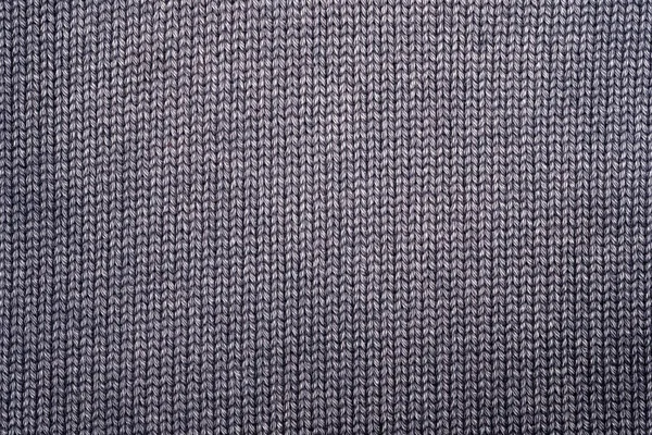 Fragment of knitted clothes in gray. Close-up. Top view — Stock Photo, Image