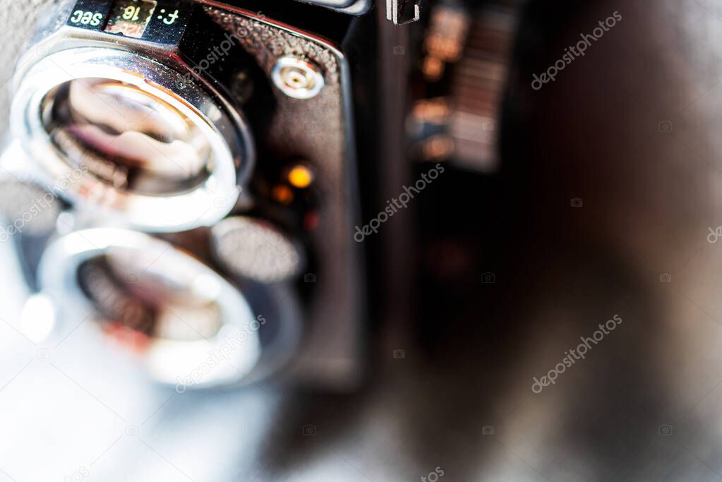 Blurred photo close-up of a fragment of an old Twin Lens Reflex camera. Copyspace