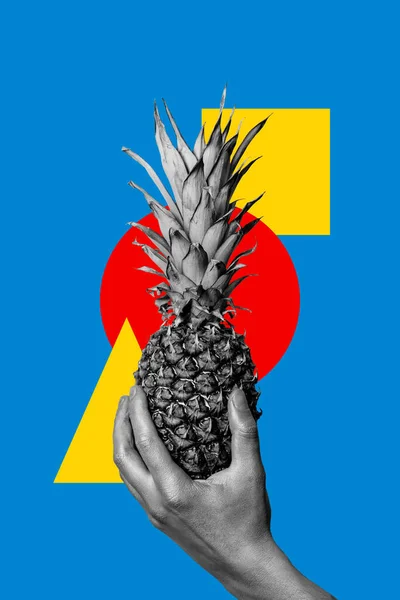 Black and white male hand with pineapple on a blue background with a square, circle and triangle. Collage art.