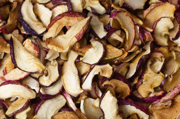 Dried Apple chips close-up. Natural background of chips. Organic natural food. Top view. Flat lay.