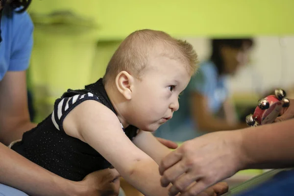 Portrait of a baby with cerebral palsy on physiotherapy — Stock Photo, Image