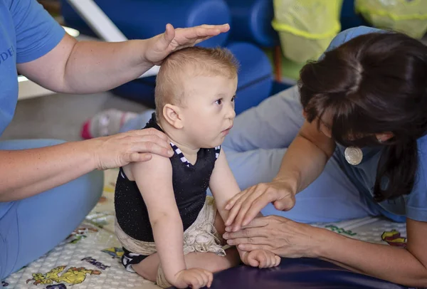 Portrait of a baby with cerebral palsy on physiotherapy — Stock Photo, Image