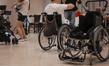 Wheelchair event. Handicapped people have fun at a party. 