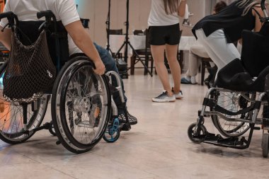 Wheelchair event. Handicapped people have fun at a party. 