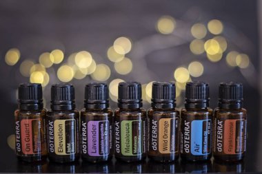 Banska Bystrica, Slovakia - November 27th 2019: High quality essential oils Doterra brand. Healthcare and wellbeing concept. Aromatherapy oils. Bokeh background. Space for text.