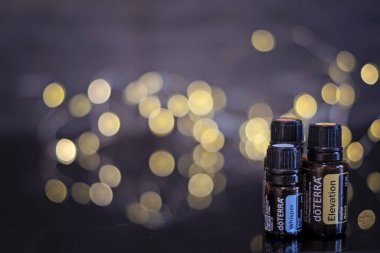 Banska Bystrica, Slovakia - November 27th 2019: High quality essential oils Doterra brand. Healthcare and wellbeing concept. Aromatherapy oils. Bokeh background. Space for text.