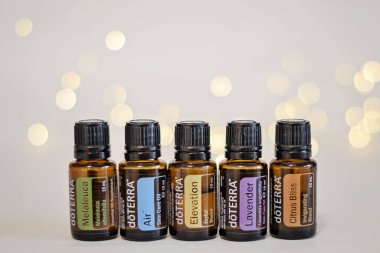 Banska Bystrica, Slovakia - November 27th 2019: High quality essential oils Doterra brand. Healthcare and wellbeing concept. Aromatherapy oils. Bokeh background. Space for text.