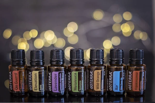 Banska Bystrica, Slovakia - November 27th 2019: High quality essential oils Doterra brand. Healthcare and wellbeing concept. Aromatherapy oils. Bokeh background. Space for text.