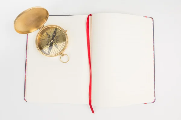 Kompass med tomma sidor notebook. — Stockfoto