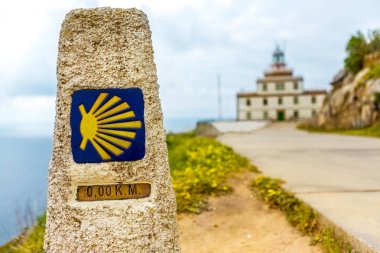 A pointer for the orientation of the Camino de Santiago pilgrims in Cape Finisterre.  clipart