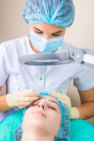 Cleaning treatment the young skin of a teenager with tools. — Stock Photo, Image