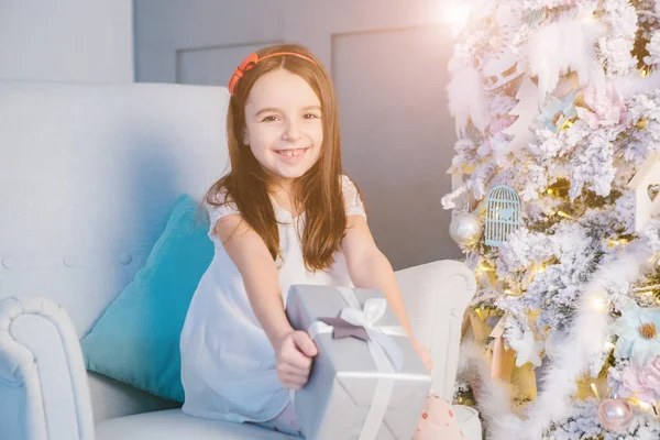 Kid girl opening Christmas presents. — Stock Photo, Image