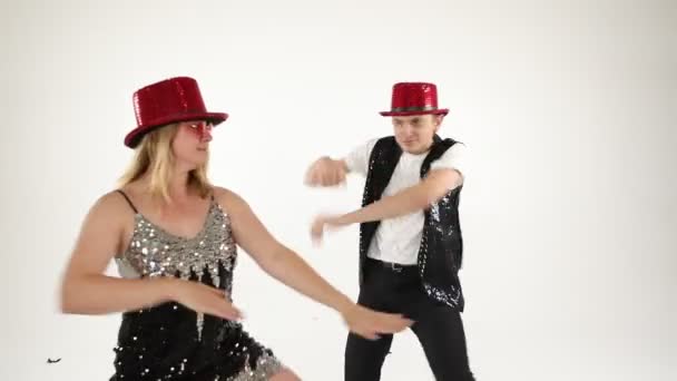 Fancy funny stylish happy silly couple friends having fun. Dance like nobodys watching. Happy party mood. White background video footage. — Stock Video