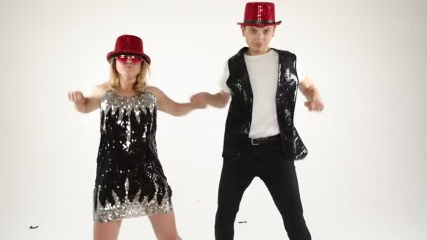 Fancy funny stylish happy silly couple friends having fun. Dance like nobodys watching. Happy party mood. White background video footage. — Stock Video
