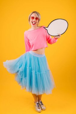 Happy smiling woman super brigts colors holding speech bubble clipart