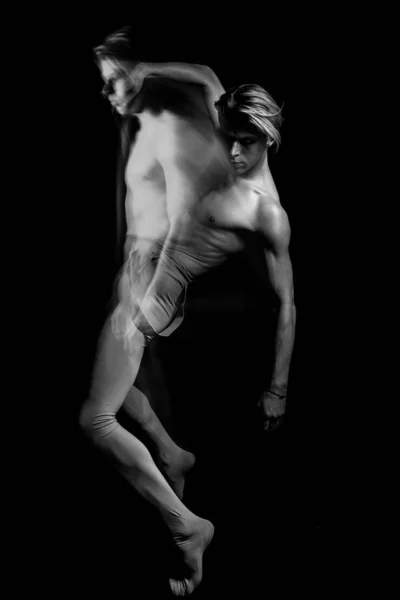 Ballet dancer naked torso. contemporary art dance. creative emotional long exposure. Double personality symbol. Black and white color contrast.  Handsome sporty body young man expressive body language