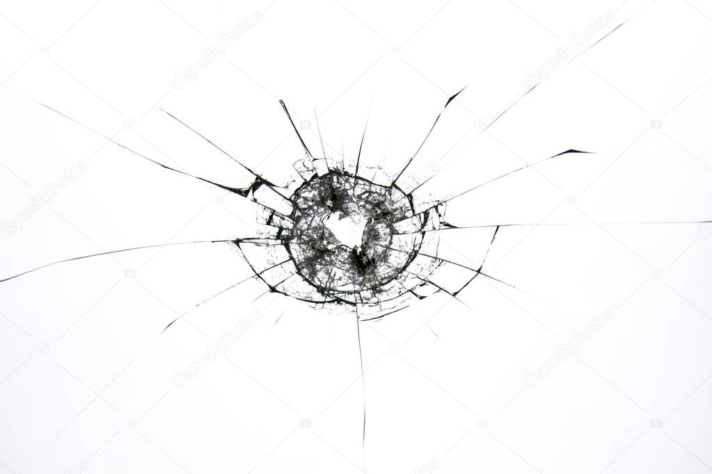 The texture of broken cracked glass after being hit by a solid object. Cracks isolated on white. Concept element for design.