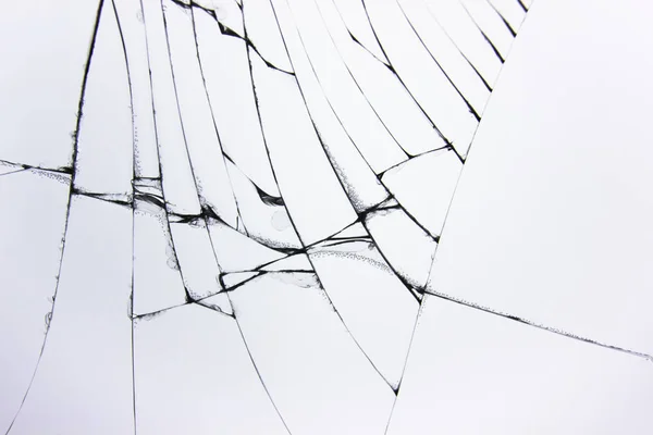 Vidrio roto agrietado en ventana sobre fondo gris claro. Concepto de grietas para el diseño . — Foto de Stock