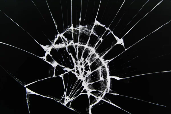 The texture of broken glass with cracks. Cracks on smartphone screen from impact. Concept for design. — ストック写真