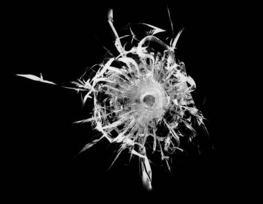 Cracked glass broken window on black background. Texture of broken windscreen.