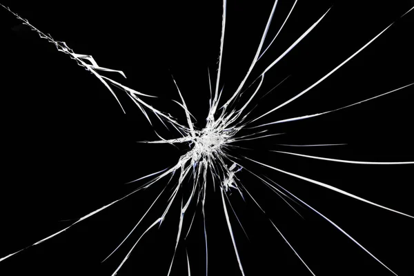 Sprickor på krossat glas. Abstraktionsmönster på fönstret. — Stockfoto