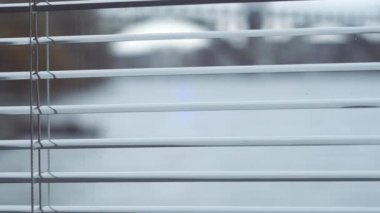 Close-up, glass, windows, open shutters, street visible, camera moves right