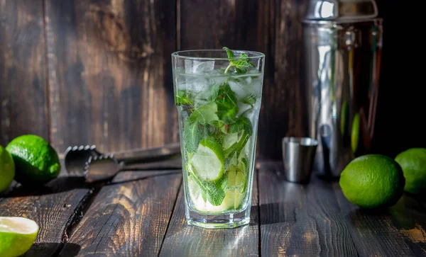 Cocktail mojito with lime, mint and ice. Recipe. Alcohol. Summer drink. Vegetarianism Health