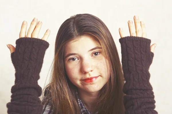 Girl show hands in woolen fingerless mittens — ストック写真