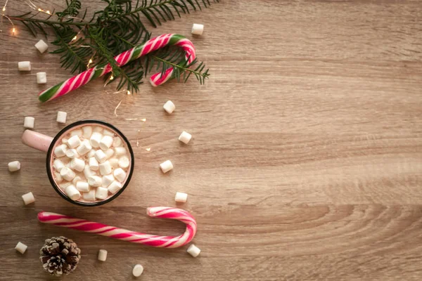 Christmas flat lay with pink cup of coffee with marshmallows and candies — Stock Photo, Image