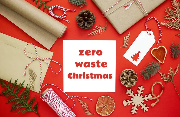 Zero waste Christmas, concept flat lay. Natural Christmas decorations made of wood and fruits without plastic. Gifts. Text on white paper. — Stock Photo, Image