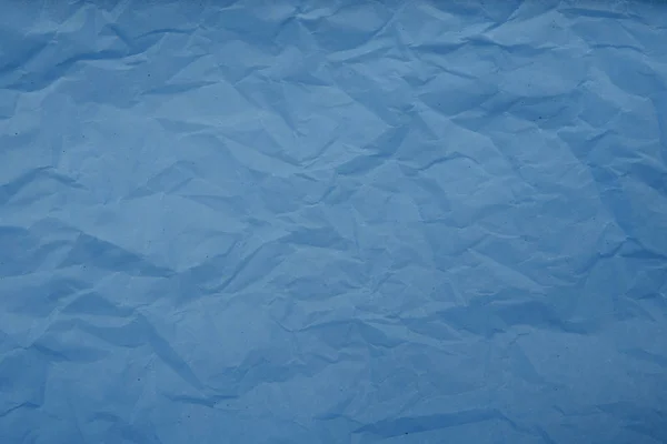 Blekt blå skrynklig papper textur bakgrund. Abstrakt mönster — Stockfoto