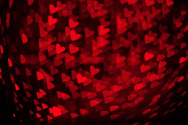 Sovrapposizione sfondo sfocato di cuori rossi bokeh, per biglietto di San Valentino o vacanze — Foto Stock