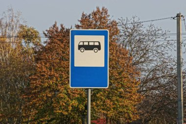 road sign bus stop on a background of vegetation and sky
