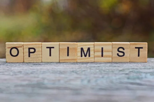 Word Optimist Made Wooden Letters Gray Table — Stock Photo, Image